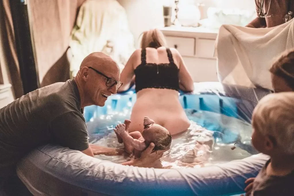Newborn baby delivered during a peaceful water birth at Divine Women's Hospital